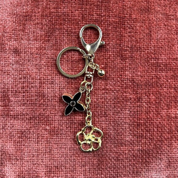 New ABSTRACT FLOWER Bag Charm Black and Gold Tone 🌺 - Picture 1 of 7